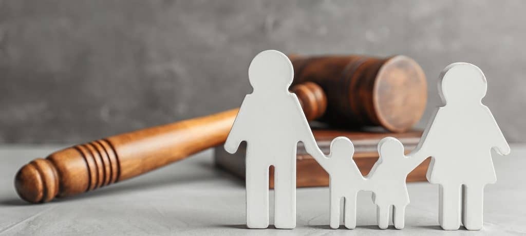 Cut out of family in front of a gavel